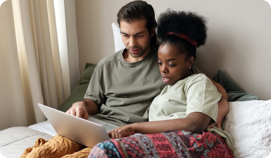 Couple looking at laptop